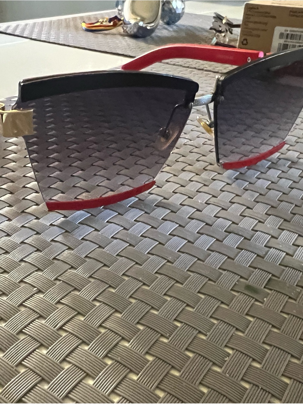 Woman’s Rimless Sunglasses with Red Accents